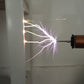 YSKJ-49 Mini Portable Handheld Tesla Coil 180W Artificial Lightning Generator Arc Gun (White Shell + Blue Coil)